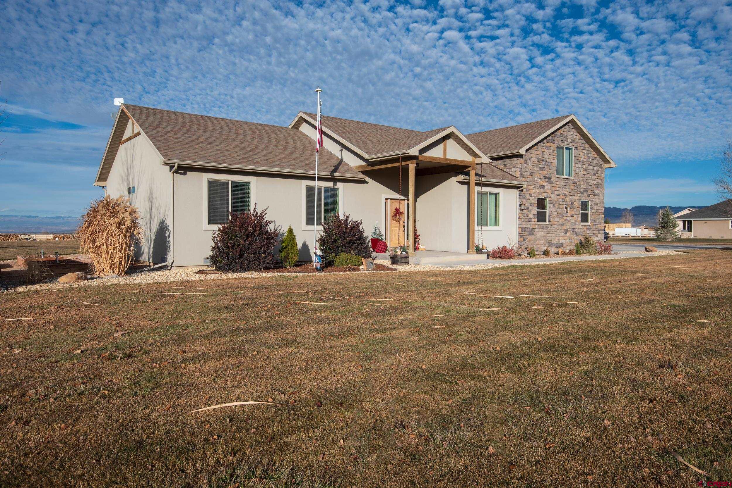 13287 6160th Road Montrose, CO 81403 - Photo 3 of 35 a view of a house with backyard
