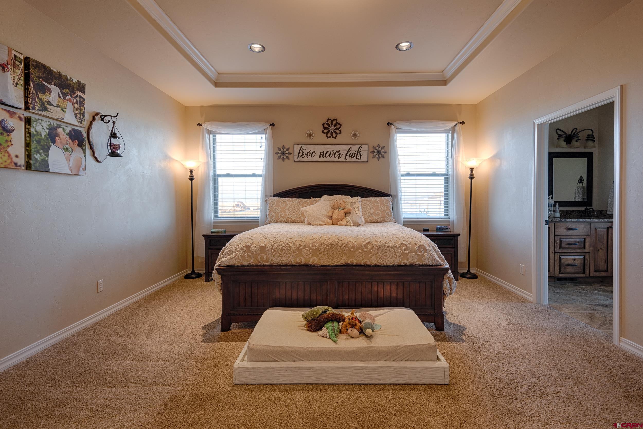 13287 6160th Road Montrose, CO 81403 - Photo 6 of 35 a bed room with a bed and a television