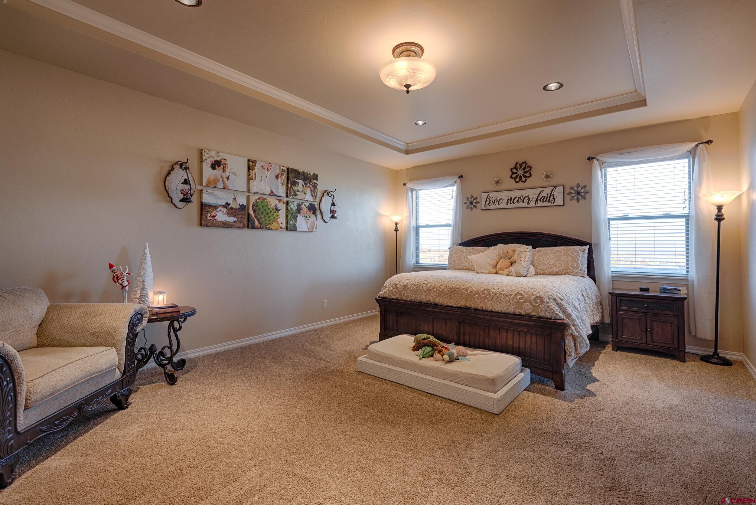 13287 6160th Road Montrose, CO 81403 - Photo 7 of 35 a bedroom with a bed and a couch