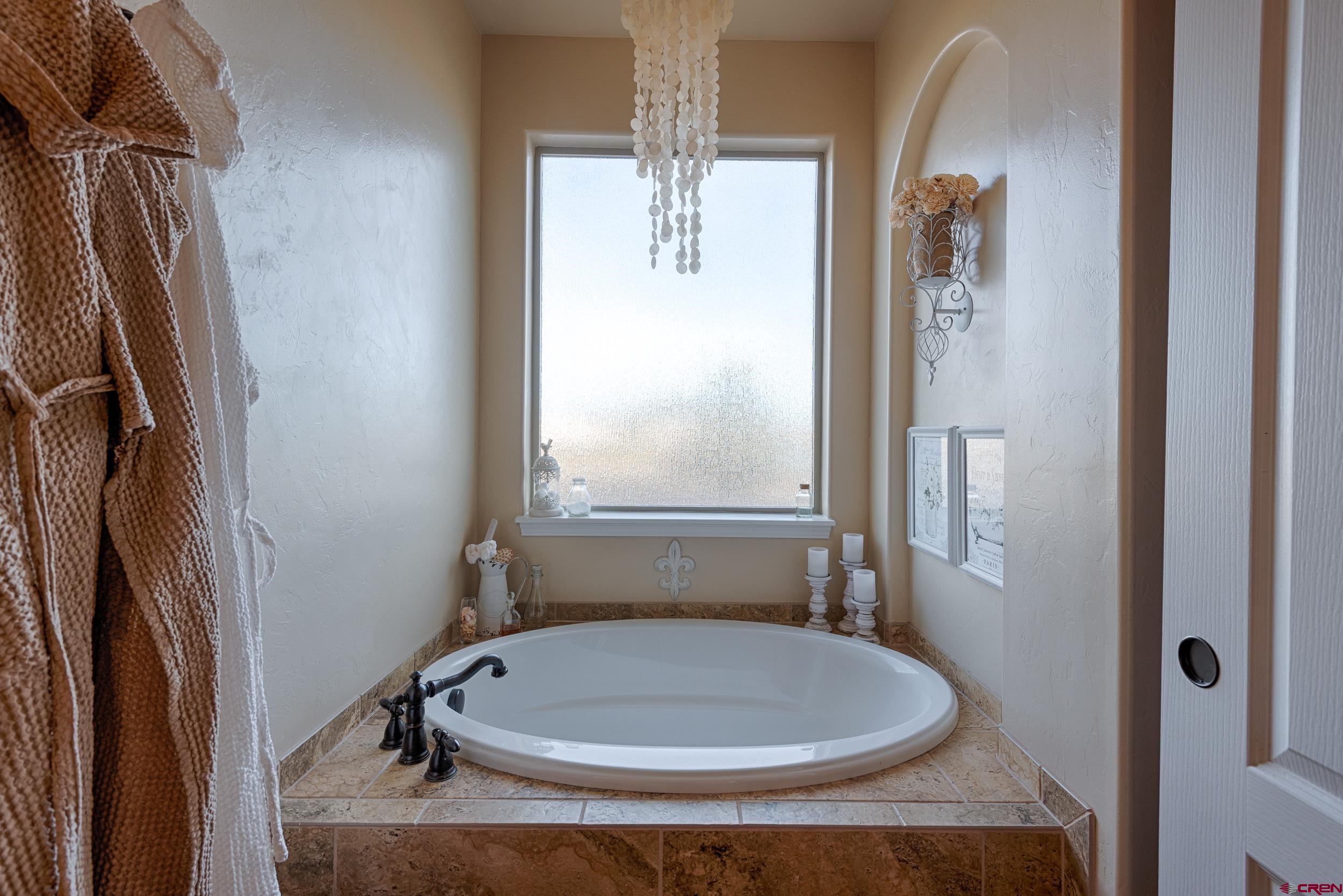 13287 6160th Road Montrose, CO 81403 - Photo 10 of 35 a bathroom with a sink and a mirror