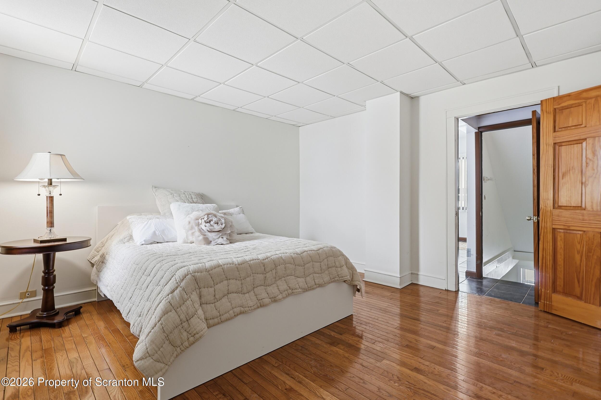 143 Old Boston Road Pittston, PA 18640 - Photo 45 of 61 a bedroom with a bed and a table