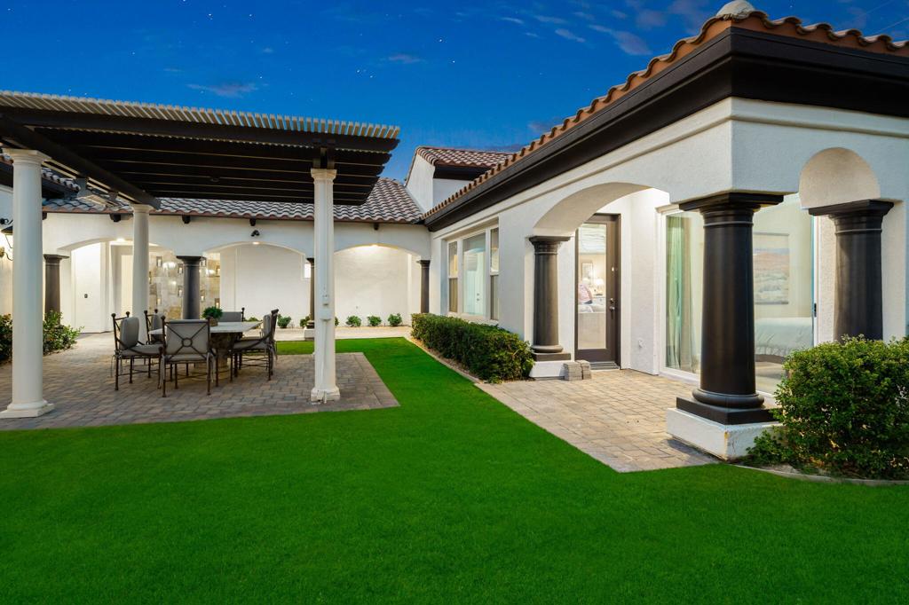 56495 Mountain La La Quinta, CA 92253 - Photo 12 of 56 a view of a porch with chairs and a yard