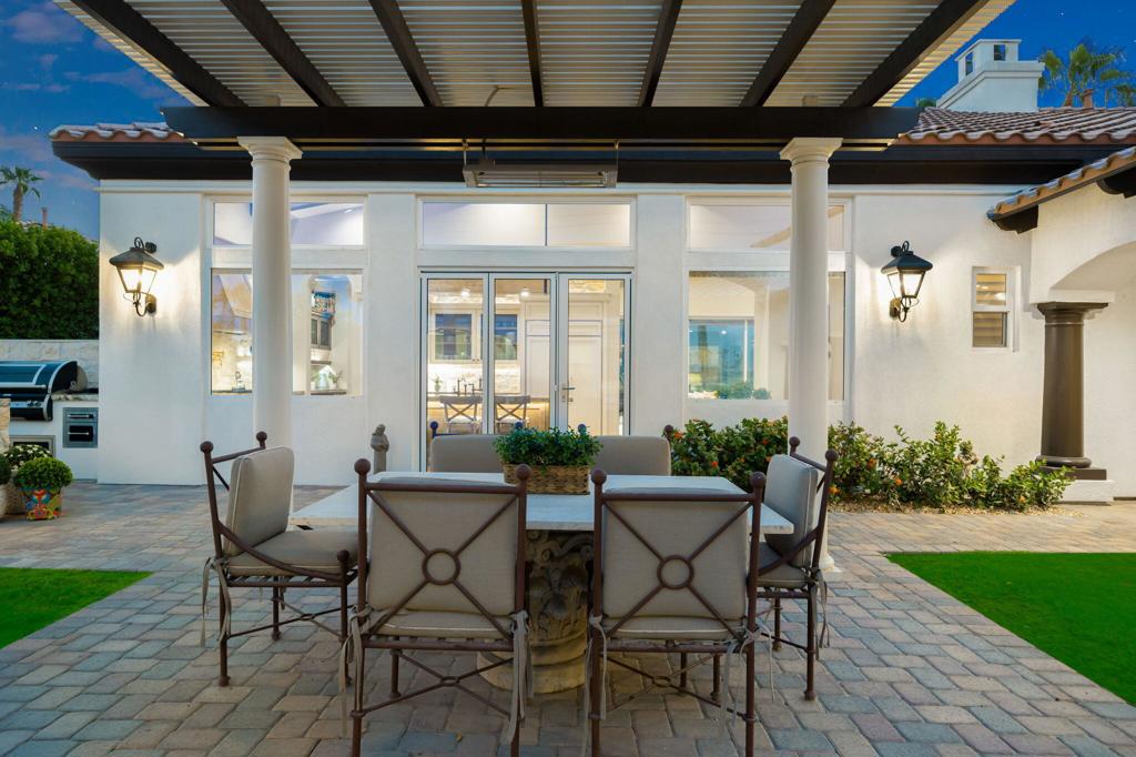 56495 Mountain La La Quinta, CA 92253 - Photo 15 of 56 a view of a porch with dining table and chairs