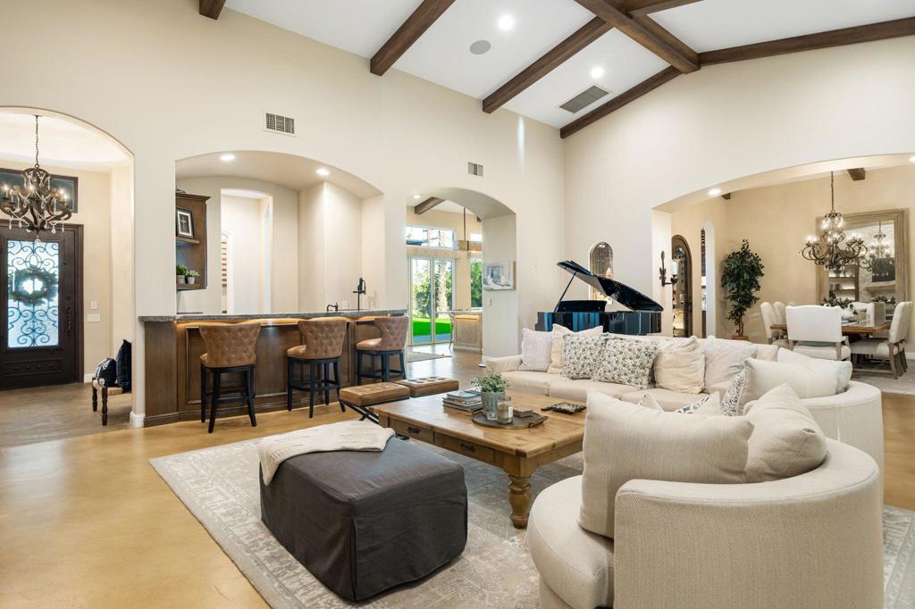 56495 Mountain La La Quinta, CA 92253 - Photo 27 of 56 a living room with furniture and a chandelier