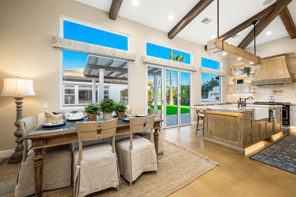 56495 Mountain La La Quinta, CA 92253 - Photo 33 of 56 a living room with fireplace furniture and a large window