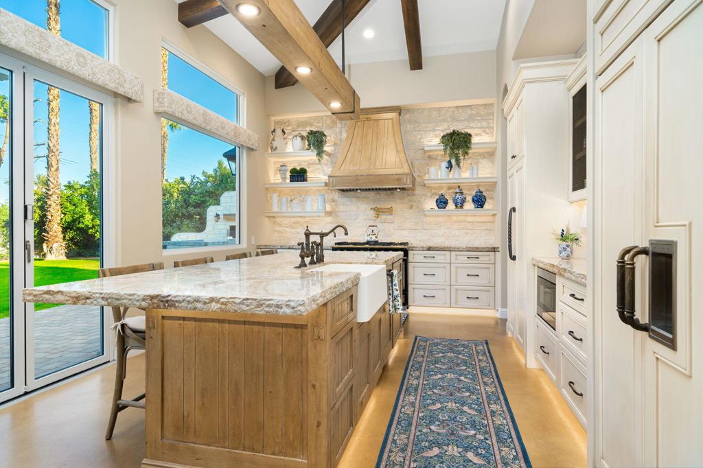 56495 Mountain La La Quinta, CA 92253 - Photo 35 of 56 a kitchen with stainless steel appliances granite countertop a sink and a refrigerator