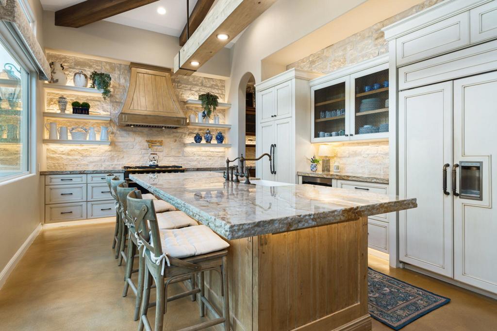 56495 Mountain La La Quinta, CA 92253 - Photo 36 of 56 a kitchen with stainless steel appliances granite countertop a sink and a refrigerator