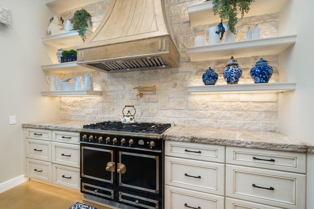 56495 Mountain La La Quinta, CA 92253 - Photo 38 of 56 a stove top oven sitting inside of a kitchen and sink
