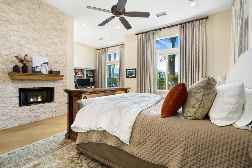 56495 Mountain La La Quinta, CA 92253 - Photo 41 of 56 a bedroom with a bed and a fireplace