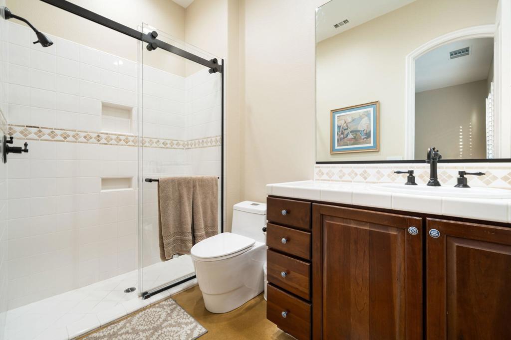 56495 Mountain La La Quinta, CA 92253 - Photo 49 of 56 a bathroom with a sink and a mirror