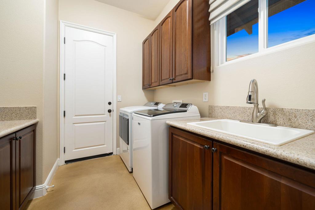 56495 Mountain La La Quinta, CA 92253 - Photo 51 of 56 a utility room with sink dryer and washer