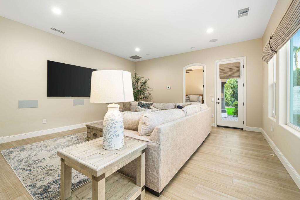 56495 Mountain La La Quinta, CA 92253 - Photo 52 of 56 a spacious bedroom with a bed and a flat screen television