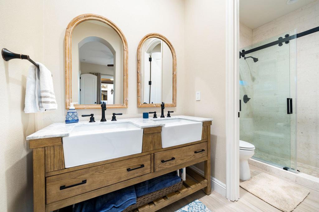 56495 Mountain La La Quinta, CA 92253 - Photo 56 of 56 a bathroom with a double vanity sink toilet and shower