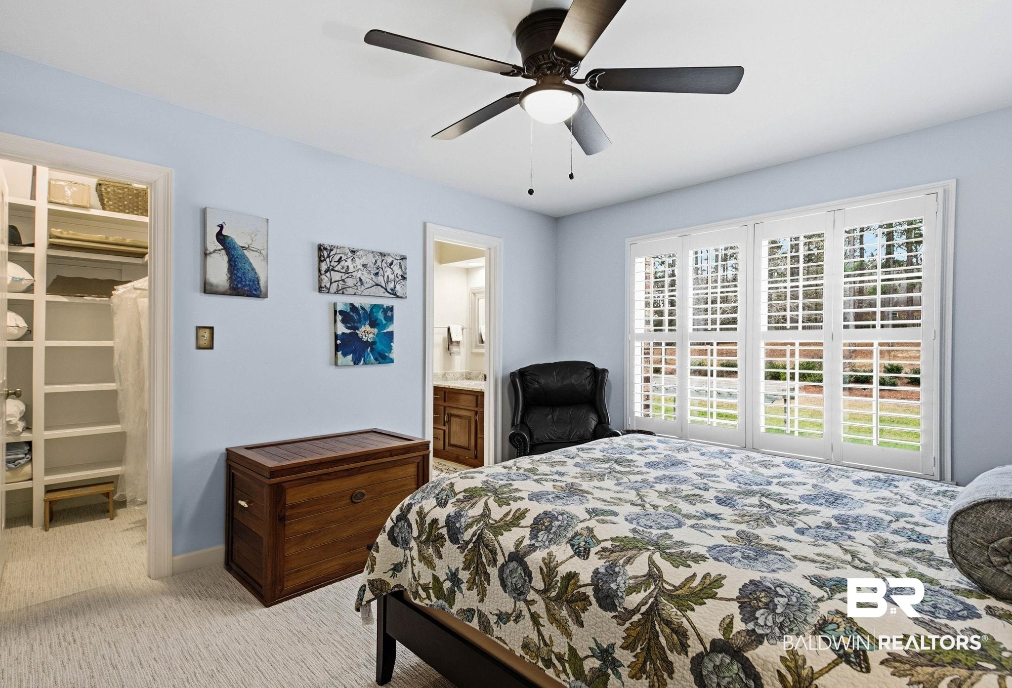 31515 Rhett Drive Spanish Fort, AL 36527 - Photo 48 of 100 Bedroom 2 measures 11' 10" x 13' 10" and has plantation shutters, a ceiling fan, a walk in closet with wooden shelving and connects with bedroom 3 via a Jack and Jill Bathroom - with each bedroom having a separate vanity and sink.