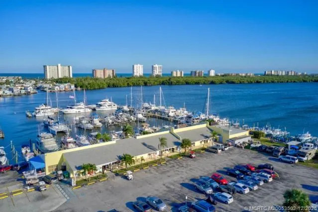 a view of a lake with a table and chairs