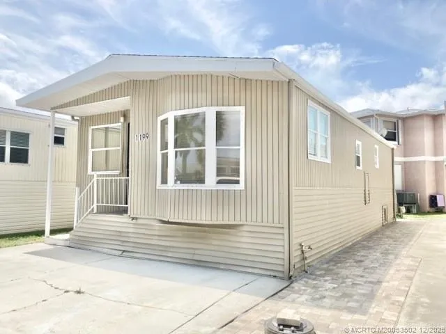 a front view of a house with a garage