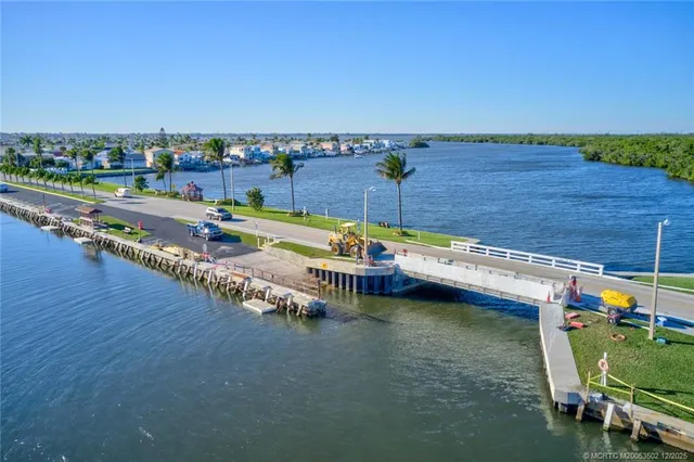 a view of a swimming pool with lawn chairs