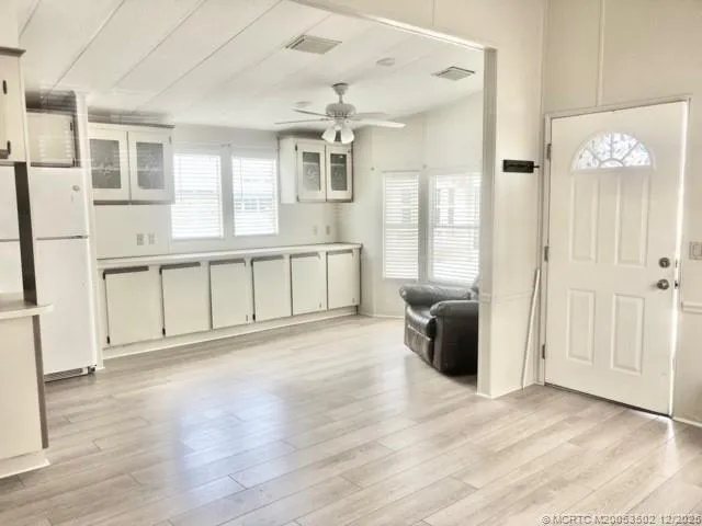 a view of a electric appliances and windows in a room