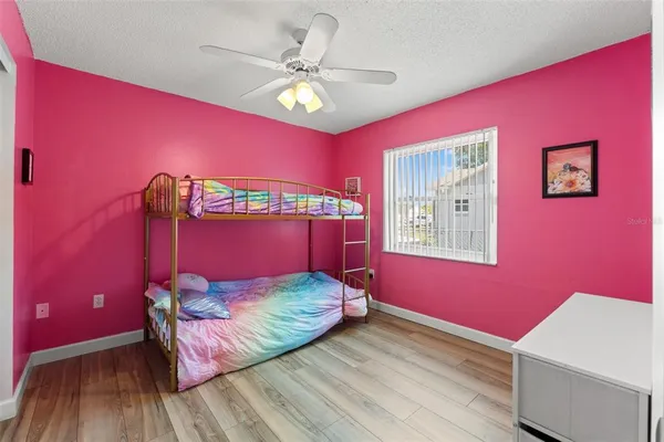a bed room with a bed and a window