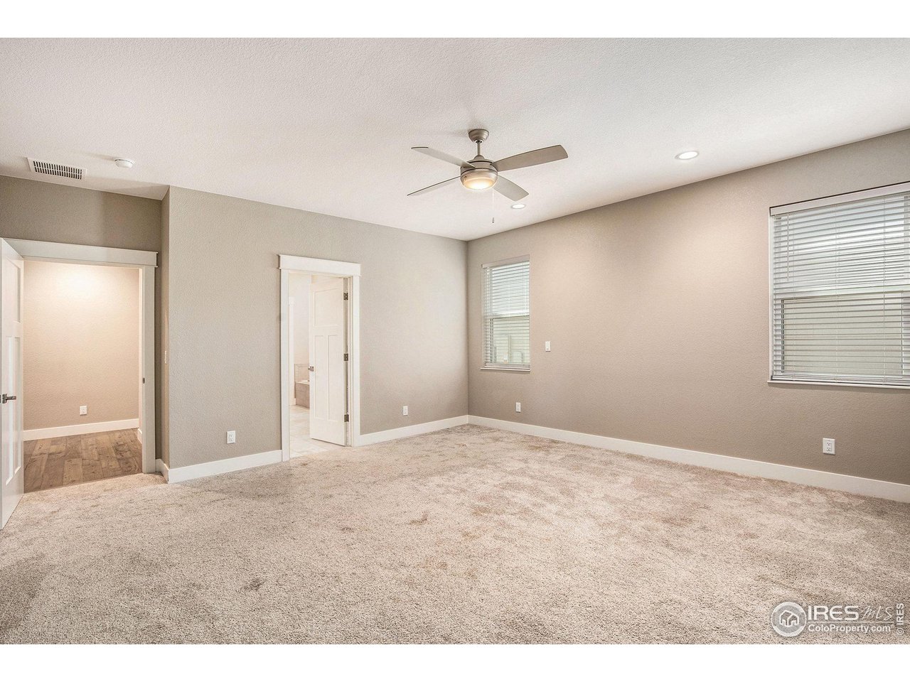 1100 Johnson Street Wiggins, CO 80654 - Photo 16 of 34 a view of an empty room with a window