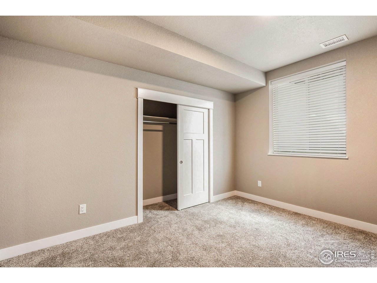 1100 Johnson Street Wiggins, CO 80654 - Photo 22 of 34 an empty room with windows