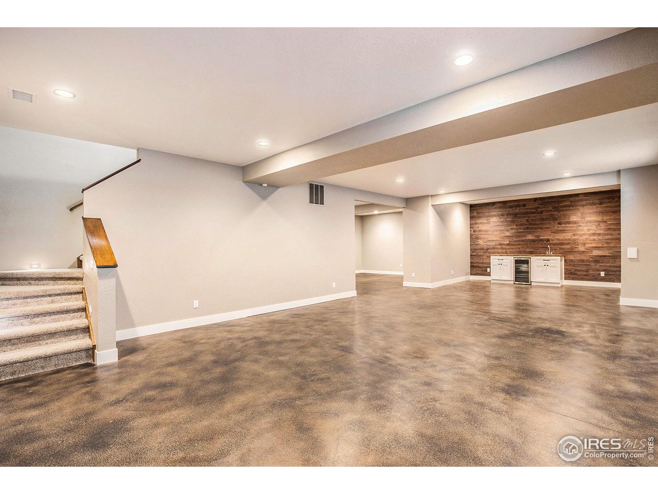 1100 Johnson Street Wiggins, CO 80654 - Photo 25 of 34 a view of empty room with wooden floor