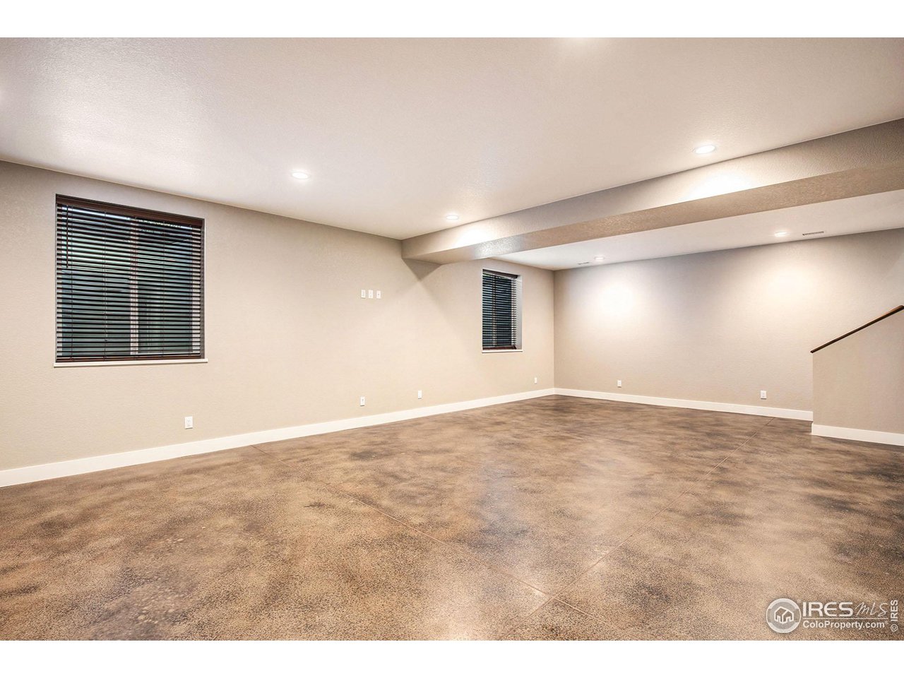 1100 Johnson Street Wiggins, CO 80654 - Photo 26 of 34 a view of an empty room with wooden floor