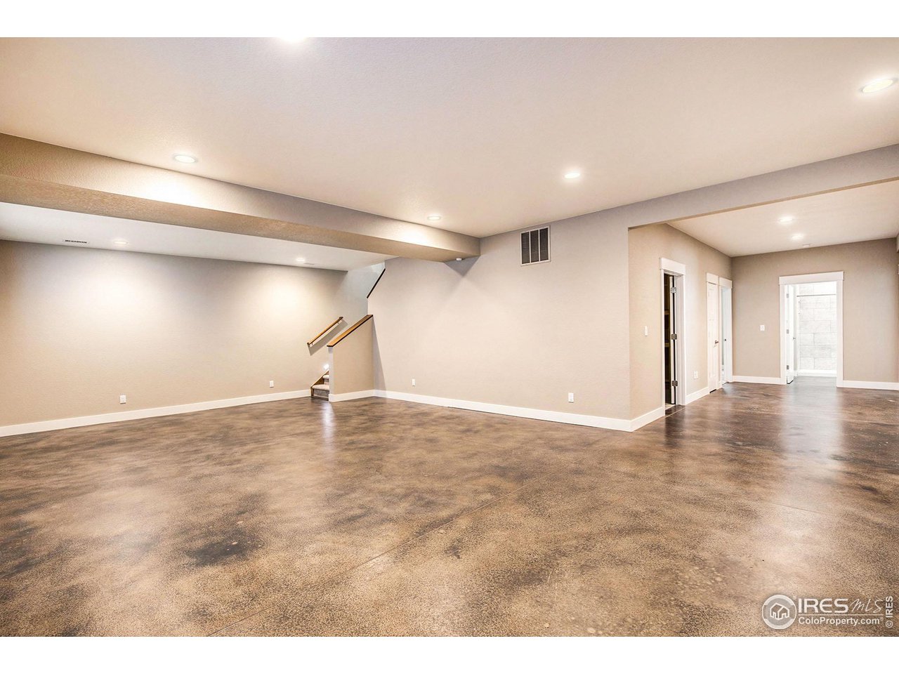1100 Johnson Street Wiggins, CO 80654 - Photo 27 of 34 a view of empty room with wooden floor