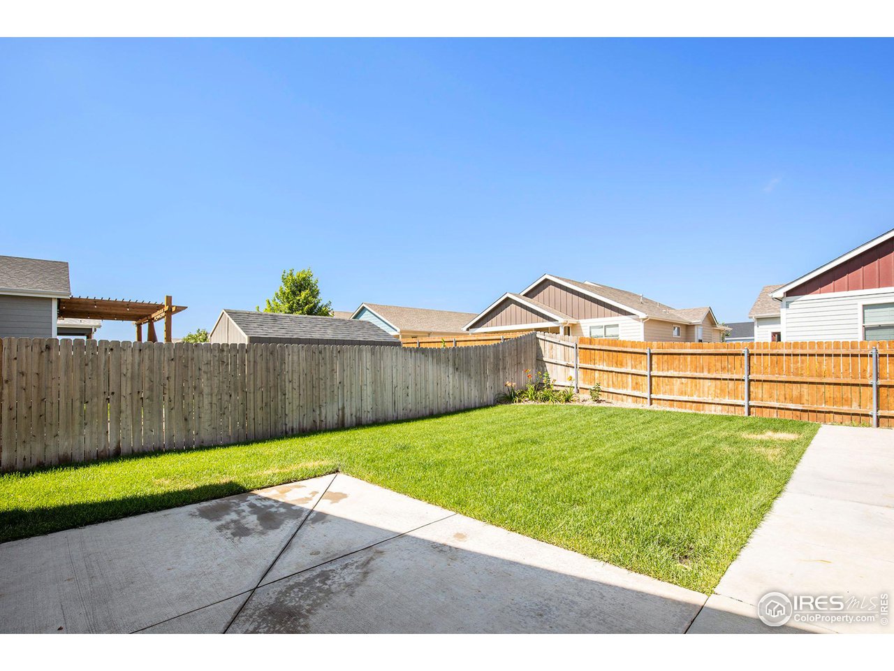1100 Johnson Street Wiggins, CO 80654 - Photo 29 of 34 a view of backyard with wooden fence