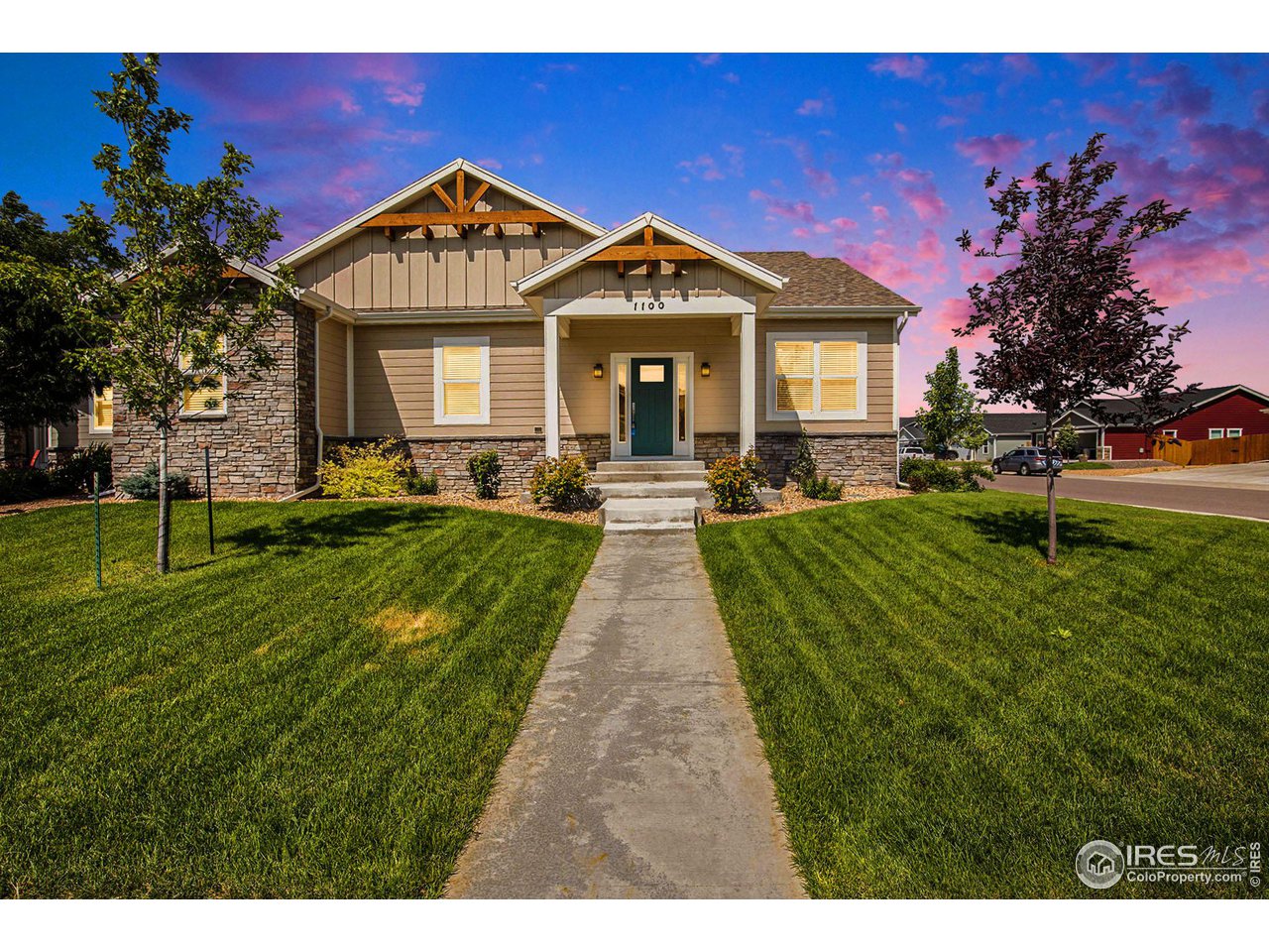 1100 Johnson Street Wiggins, CO 80654 - Photo 32 of 34 a front view of a house with a yard