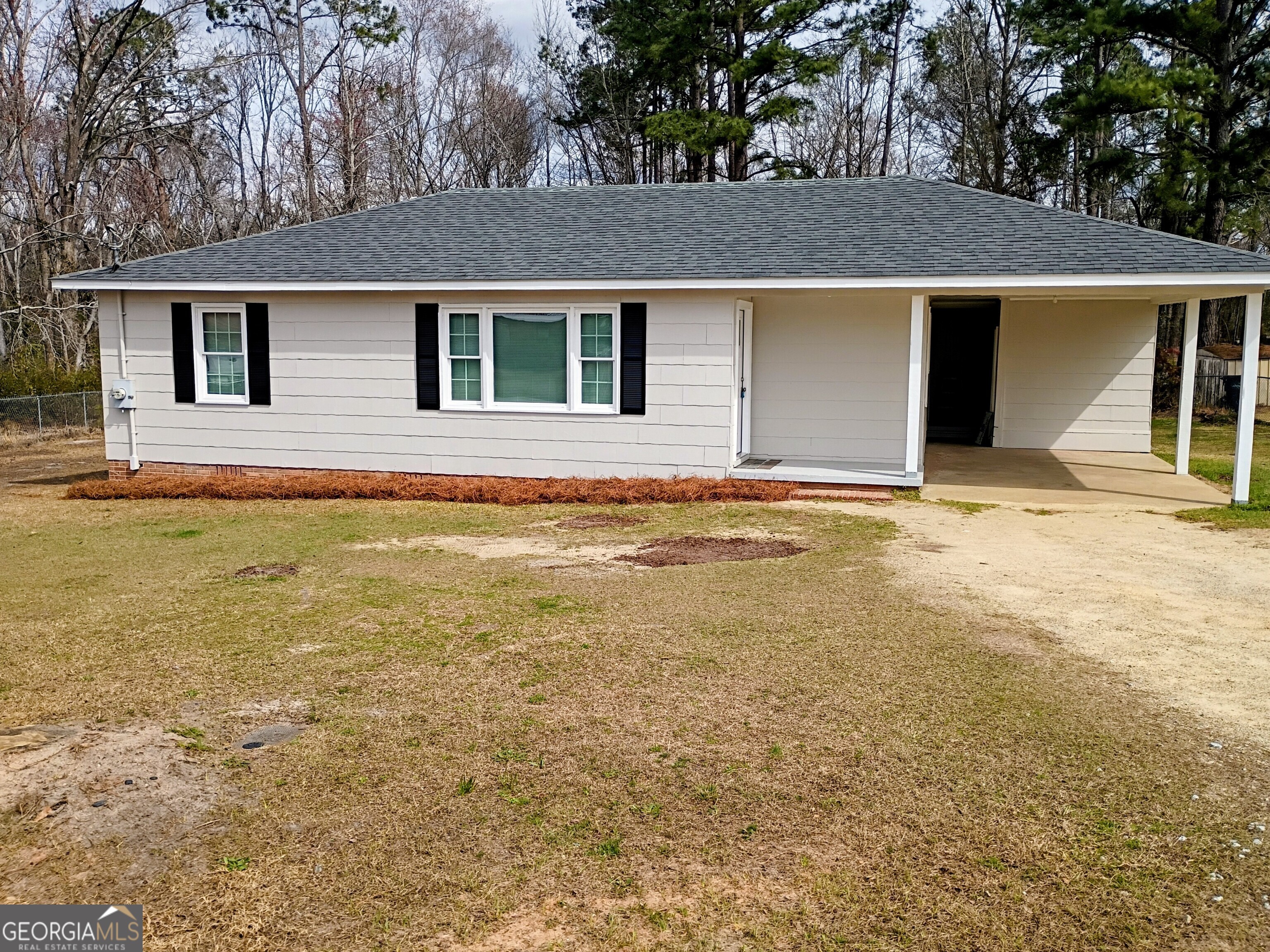 624 Thompson Road Swainsboro, GA 30401 - Photo 1 of 20 a view of a house with a yard and garage