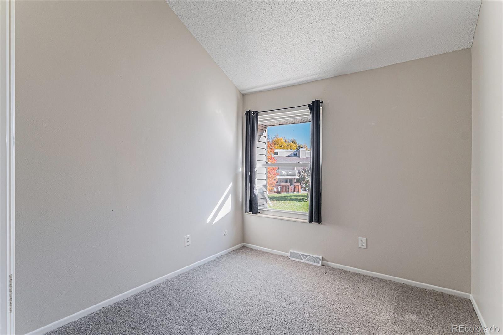 4262 East Maplewood Way Centennial, CO 80121 - Photo 11 of 32 an empty room with window