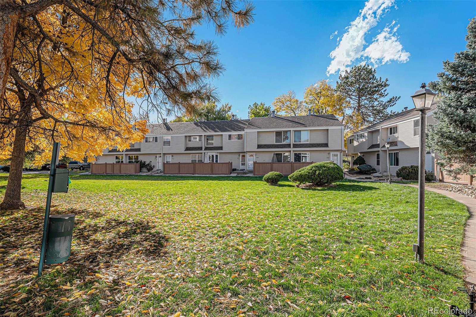 4262 East Maplewood Way Centennial, CO 80121 - Photo 24 of 32 a view of a house with a yard