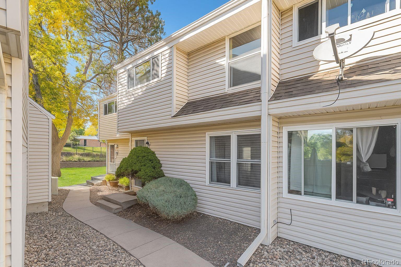 4262 East Maplewood Way Centennial, CO 80121 - Photo 5 of 32 a view of a house with a backyard