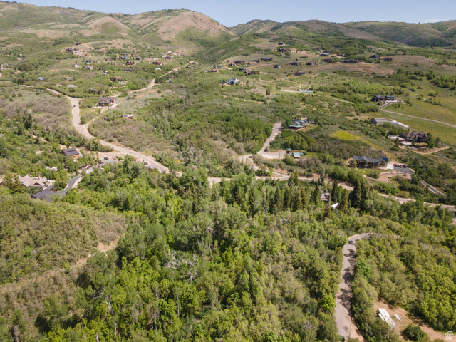 6449 North North Fork Road Eden, UT 84310 - Photo 25 of 38 Expansive mountainous terrain featuring scattered residential properties, winding roads, and dense tree coverage