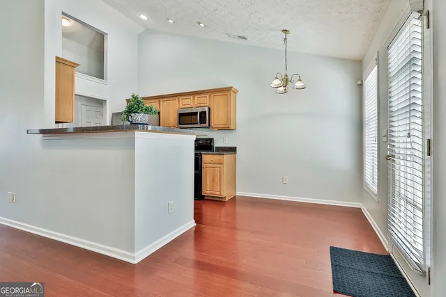 a view of a livingroom with wooden floor