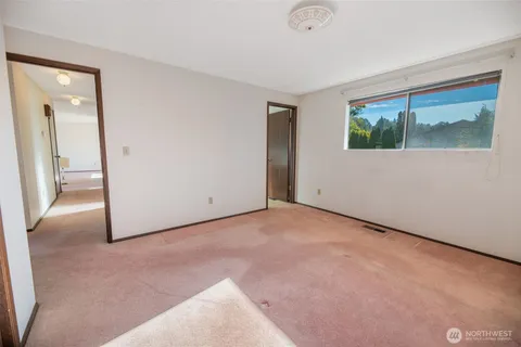 an empty room with a mirror