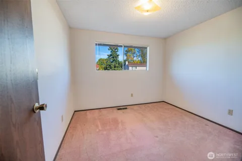 a bathroom with a tub a sink and a shower