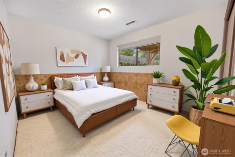 a spacious bedroom with a large bed and a window