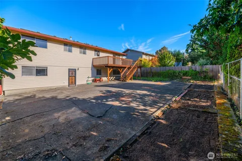 a view of a deck with wooden floor and outdoor space