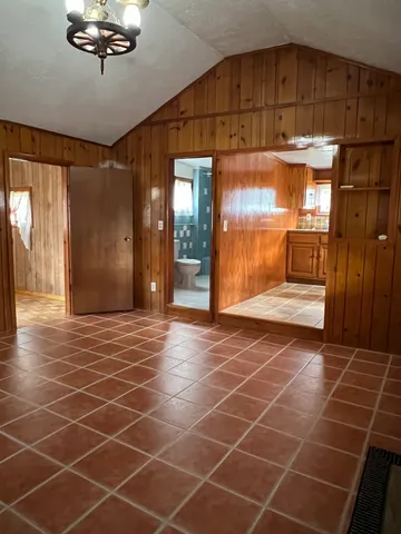 a view of a room with a glass door