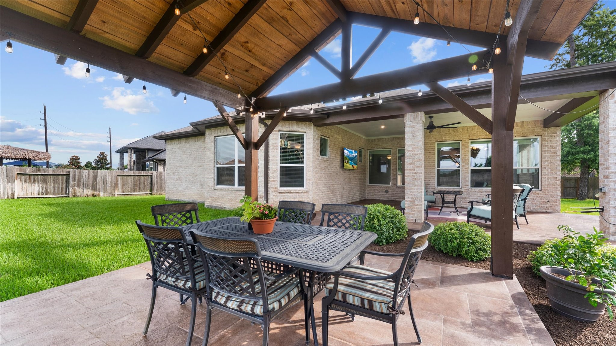32001 Birch Briar Court Spring, TX 77386 - Photo 45 of 48 Enjoy resort-style outdoor living with a custom pavilion, expansive patio, and oversized backyard designed for entertaining, family gatherings, and peaceful evenings outdoors.