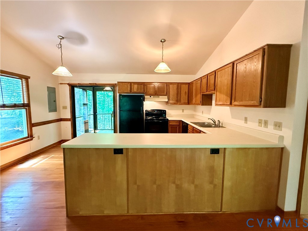 2590 Davis Mill Road Goochland, VA 23063 - Photo 11 of 33 a large kitchen with stainless steel appliances kitchen island granite countertop a refrigerator a stove and a wooden floors