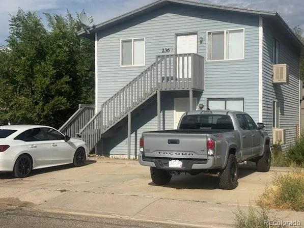 a view of a car parked in front of a house