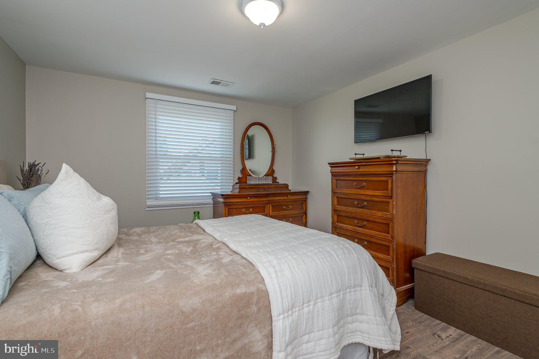 60 Midvale Lane Willingboro, NJ 08046 - Photo 20 of 24 a bedroom with a bed and a flat screen tv