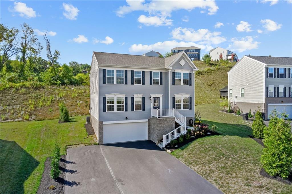 264 Lily Ridge Drive Canonsburg, PA 15317 - Photo 2 of 50 a front view of a house with garden