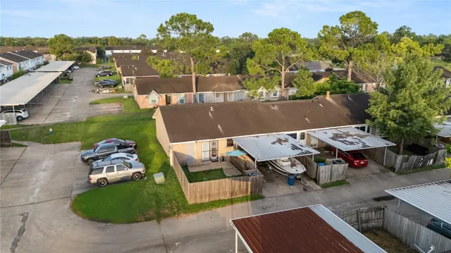 an aerial view of a house with outdoor space