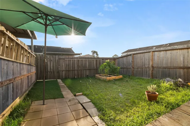 a view of a backyard with sitting area