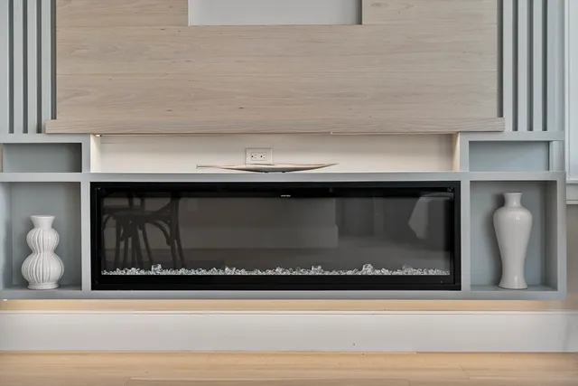 a living room with furniture and large window