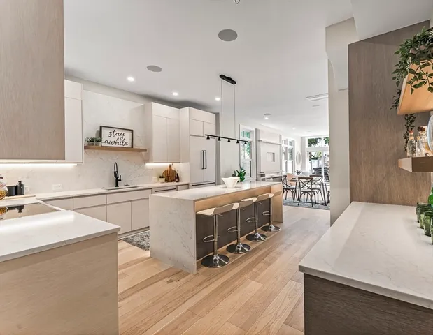 a bathroom with a shower and a sink